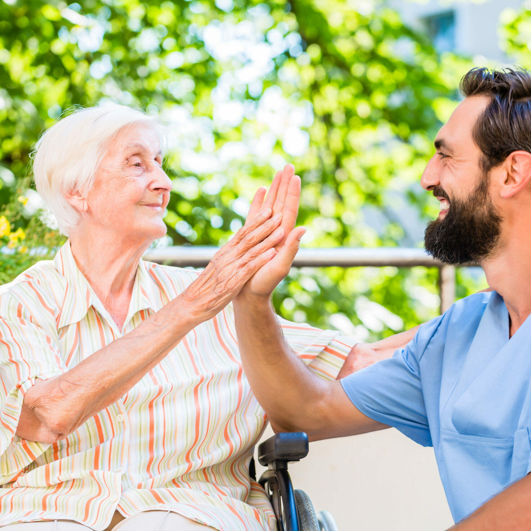 Senior,Woman,And,Nurse,Giving,High,Five,In,Nursery,Home Senior,Woman,And,Nurse,Giving,High,Five,In,Nursery,Home